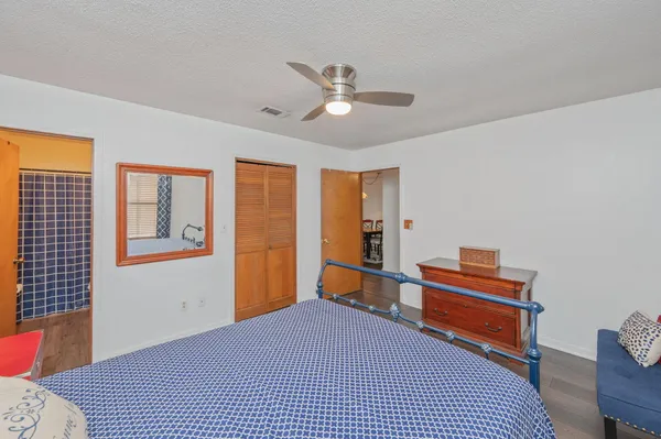 a bedroom with furniture and a window