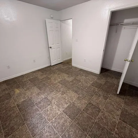 an empty room with sliding door