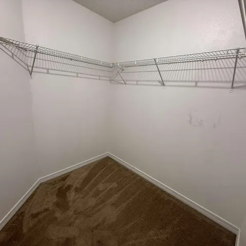 a view of a room with racks on the wall