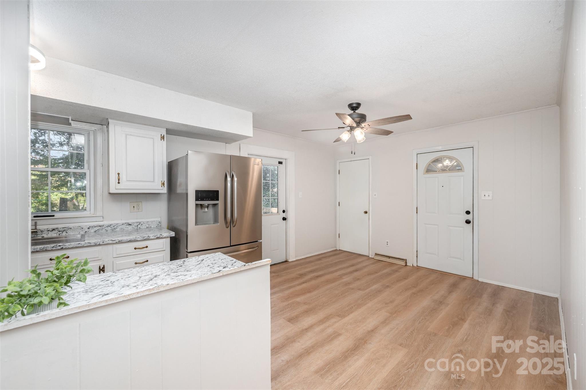 1324 Jefferson Street Lancaster, SC 29720 - Photo 3 of 16 a view of a kitchen with a sink and a refrigerator