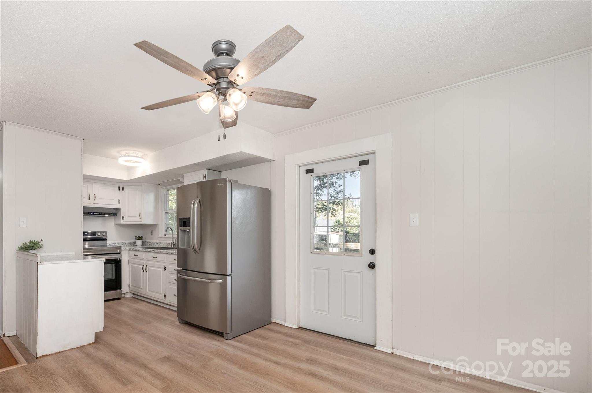 1324 Jefferson Street Lancaster, SC 29720 - Photo 5 of 16 a kitchen with stainless steel appliances a refrigerator and a microwave