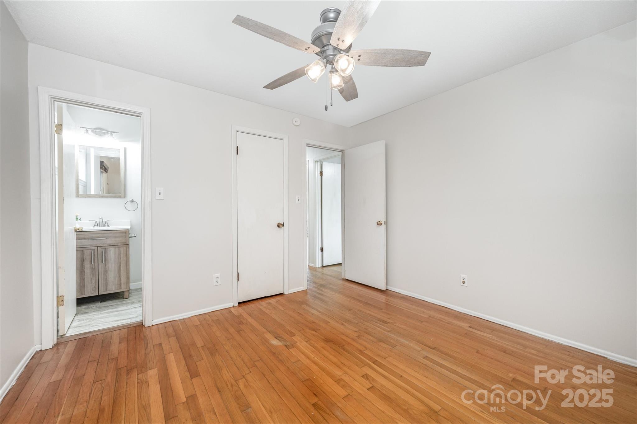 1324 Jefferson Street Lancaster, SC 29720 - Photo 9 of 16 a view of a room with a stylish ceiling fan and entryway