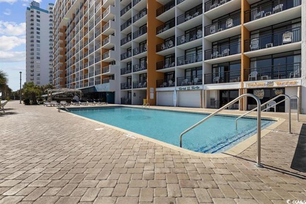 1501 South Ocean Boulevard, Unit 730 Myrtle Beach, SC 29577 - Photo 6 of 13 Community pool with a patio
