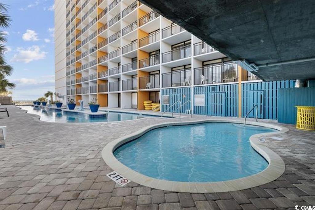 1501 South Ocean Boulevard, Unit 730 Myrtle Beach, SC 29577 - Photo 8 of 13 Community pool featuring a patio