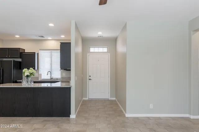 a kitchen with granite countertop a sink and stainless steel appliances