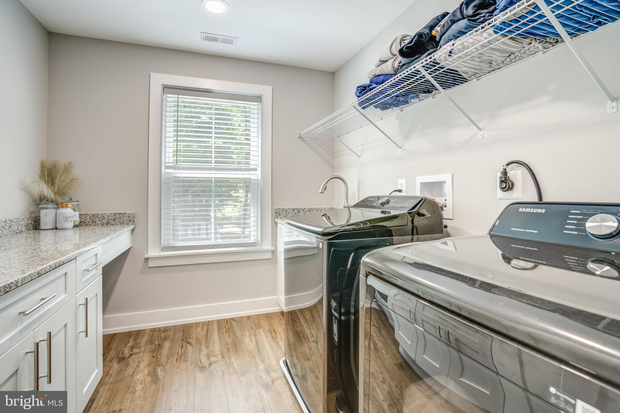 8331 Woodland Road Pasadena, MD 21122 - Photo 31 of 63 Upper Level Laundry with Granite Folding Table