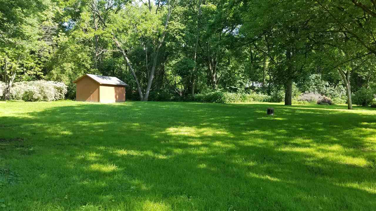 2804 South Brooks Island Road Oregon, IL 61061 - Photo 13 of 19 a front view of a house with a yard and trees