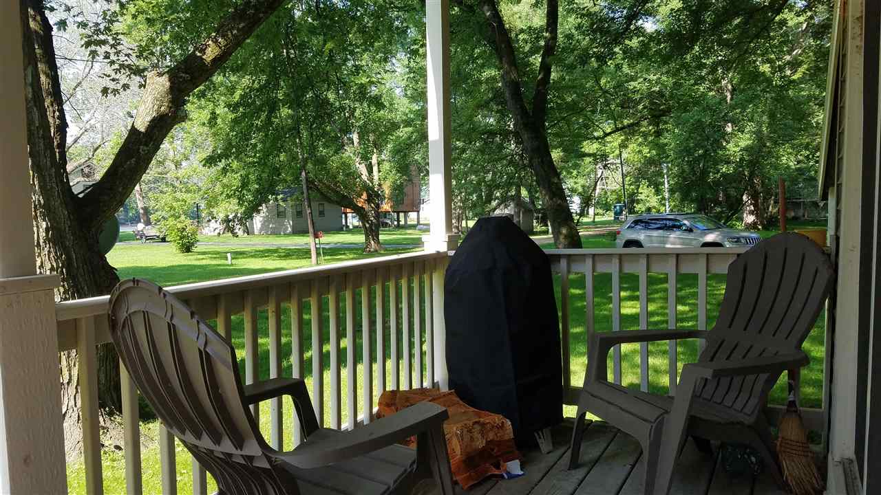 2804 South Brooks Island Road Oregon, IL 61061 - Photo 18 of 19 a view of a deck with a large window and yard