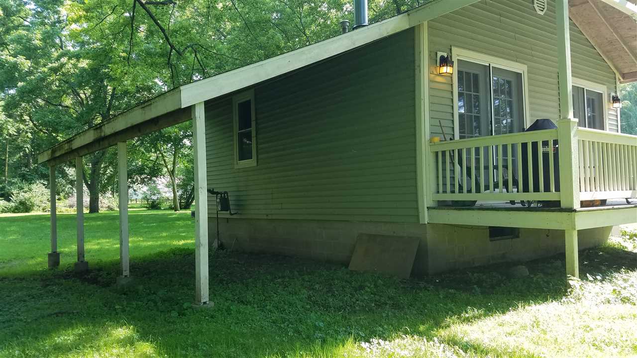 2804 South Brooks Island Road Oregon, IL 61061 - Photo 19 of 19 a backyard of a house with lots of green space