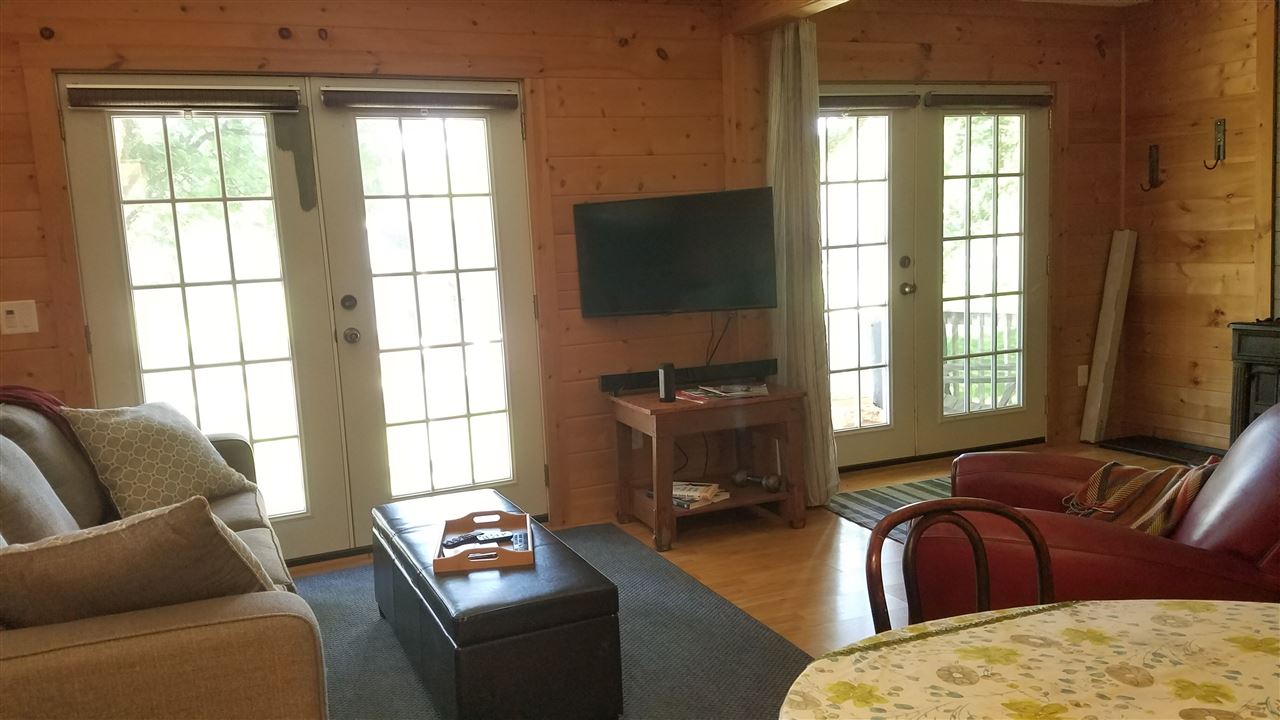 2804 South Brooks Island Road Oregon, IL 61061 - Photo 2 of 19 a living room with furniture and a flat screen tv