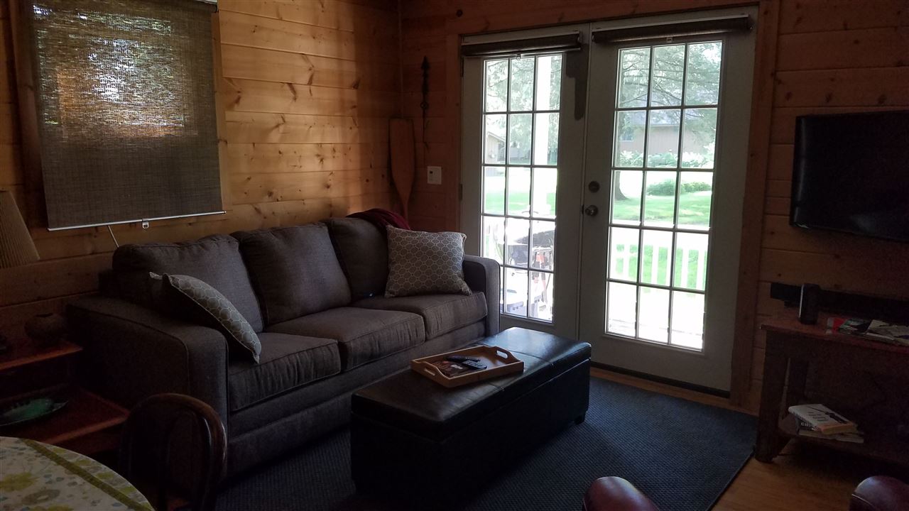 2804 South Brooks Island Road Oregon, IL 61061 - Photo 3 of 19 a living room with furniture and a flat screen tv