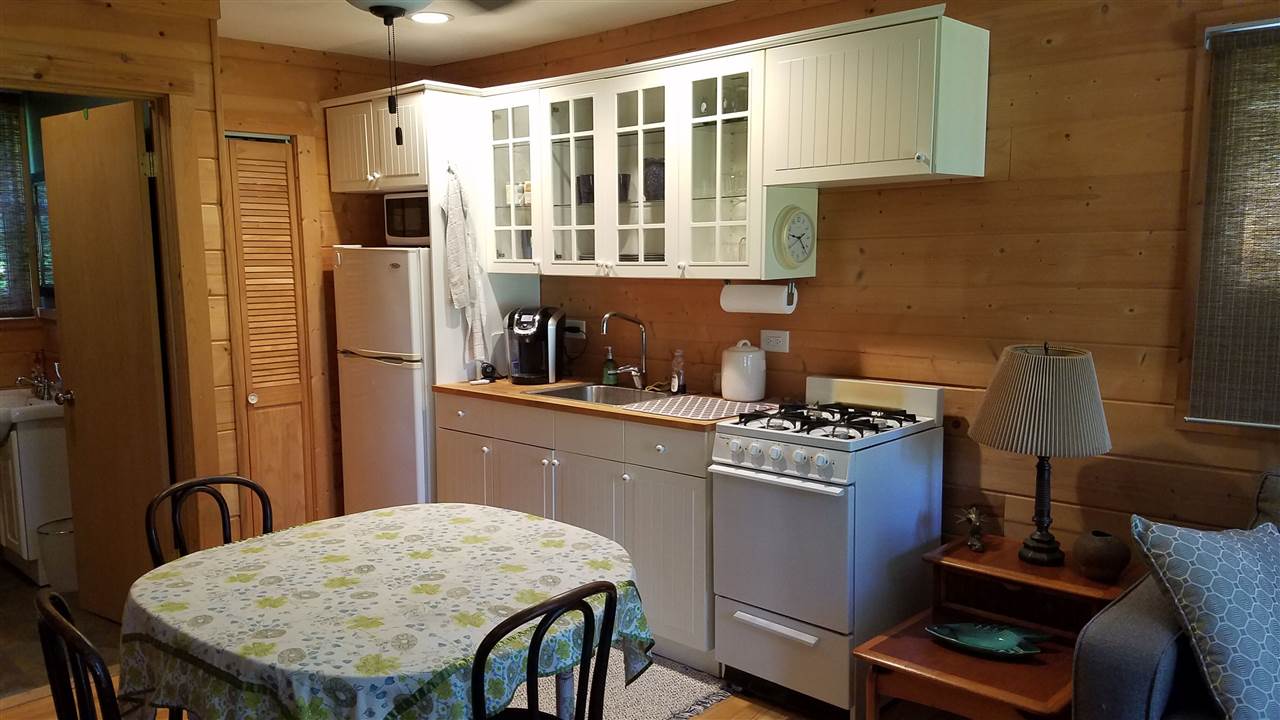 2804 South Brooks Island Road Oregon, IL 61061 - Photo 5 of 19 a kitchen with stainless steel appliances granite countertop a stove a sink dishwasher and cabinets with wooden floor