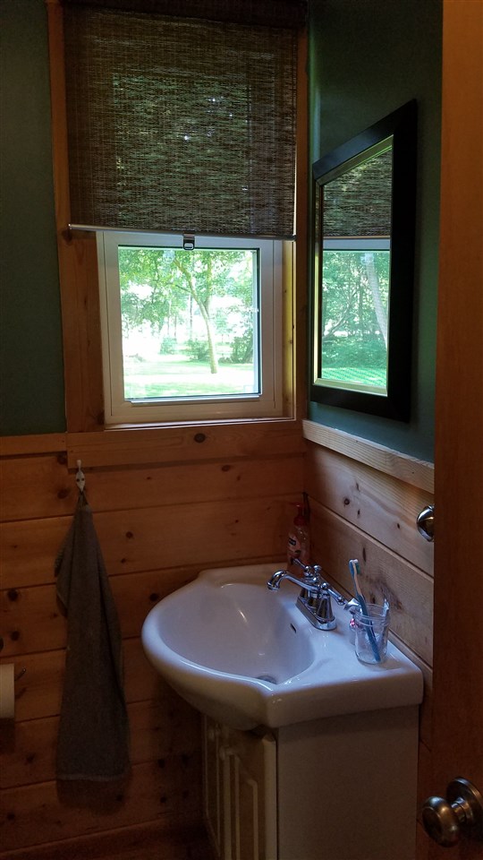 2804 South Brooks Island Road Oregon, IL 61061 - Photo 8 of 19 a bathroom with a sink a toilet and window