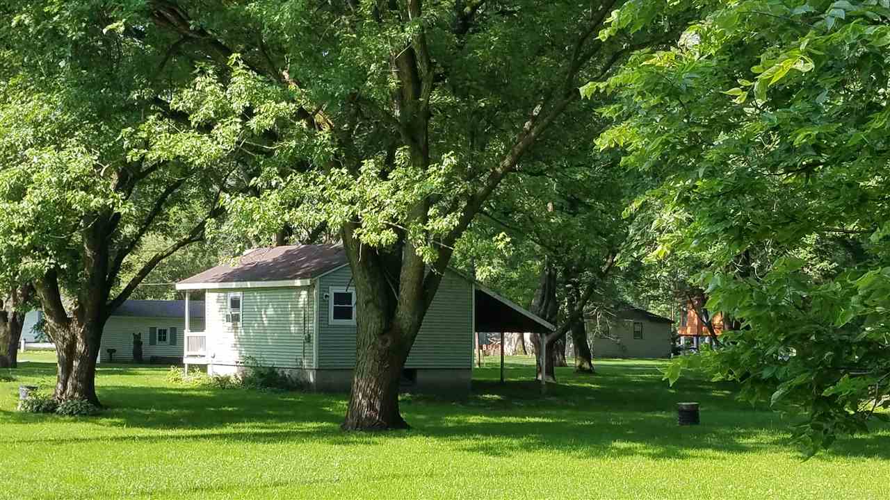 2804 South Brooks Island Road Oregon, IL 61061 - Photo 10 of 19 a front view of a house with a yard