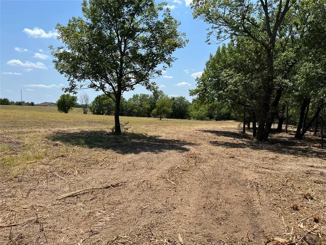 a view of a road with a yard
