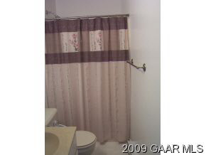 656 Battlefield Road New Hope, VA 24437 - Photo 10 of 12 a bathroom with a toilet and a shower curtain