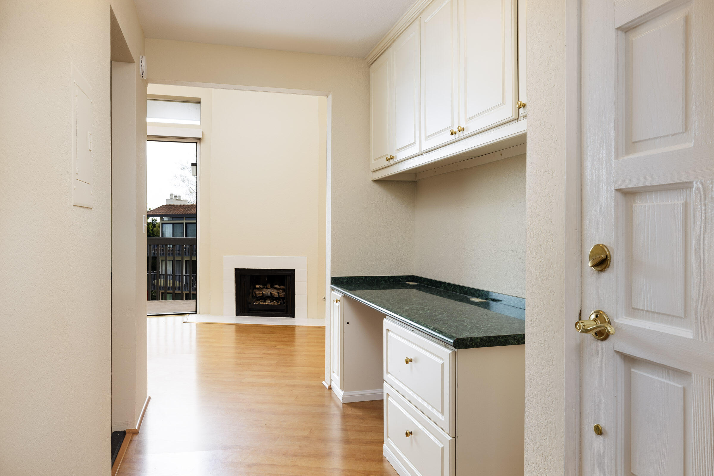 3375 Foothill Road, Unit 632 Carpinteria, CA 93013 - Photo 11 of 16 a kitchen with granite countertop a refrigerator and a stove top oven