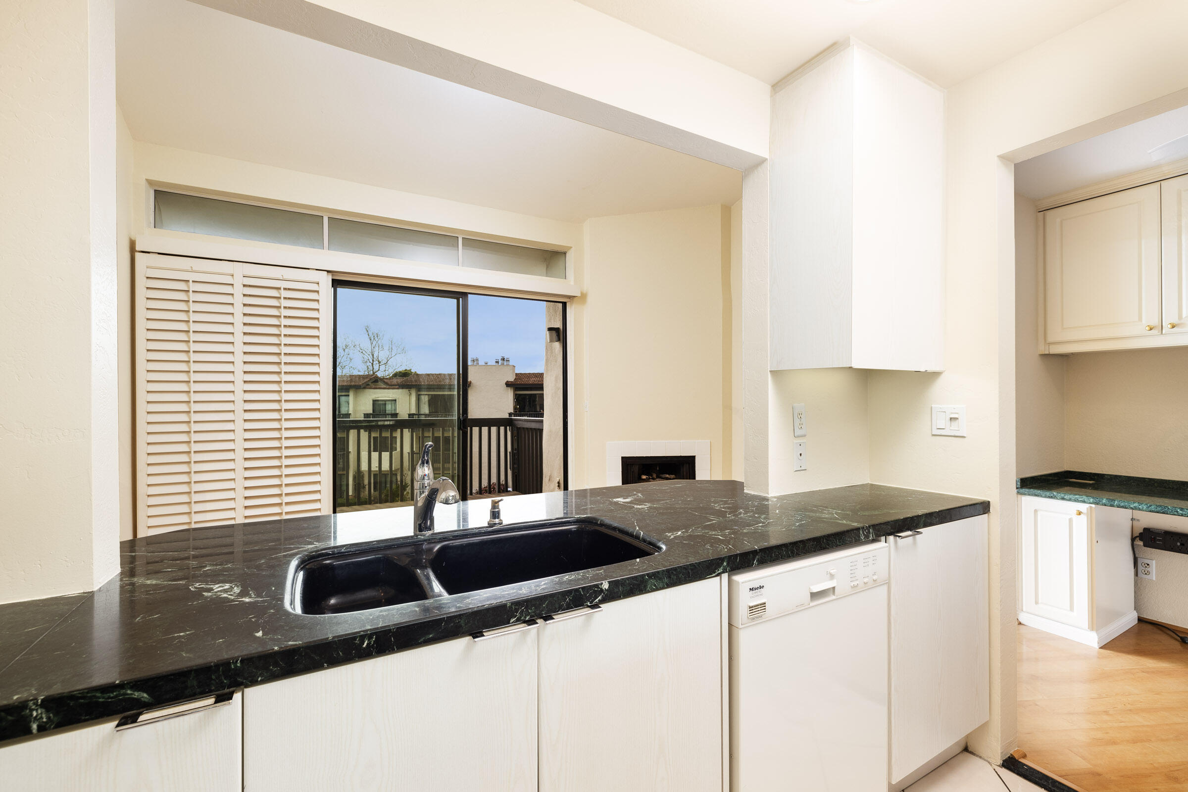 3375 Foothill Road, Unit 632 Carpinteria, CA 93013 - Photo 5 of 16 a kitchen with granite countertop a sink and a white counter top space