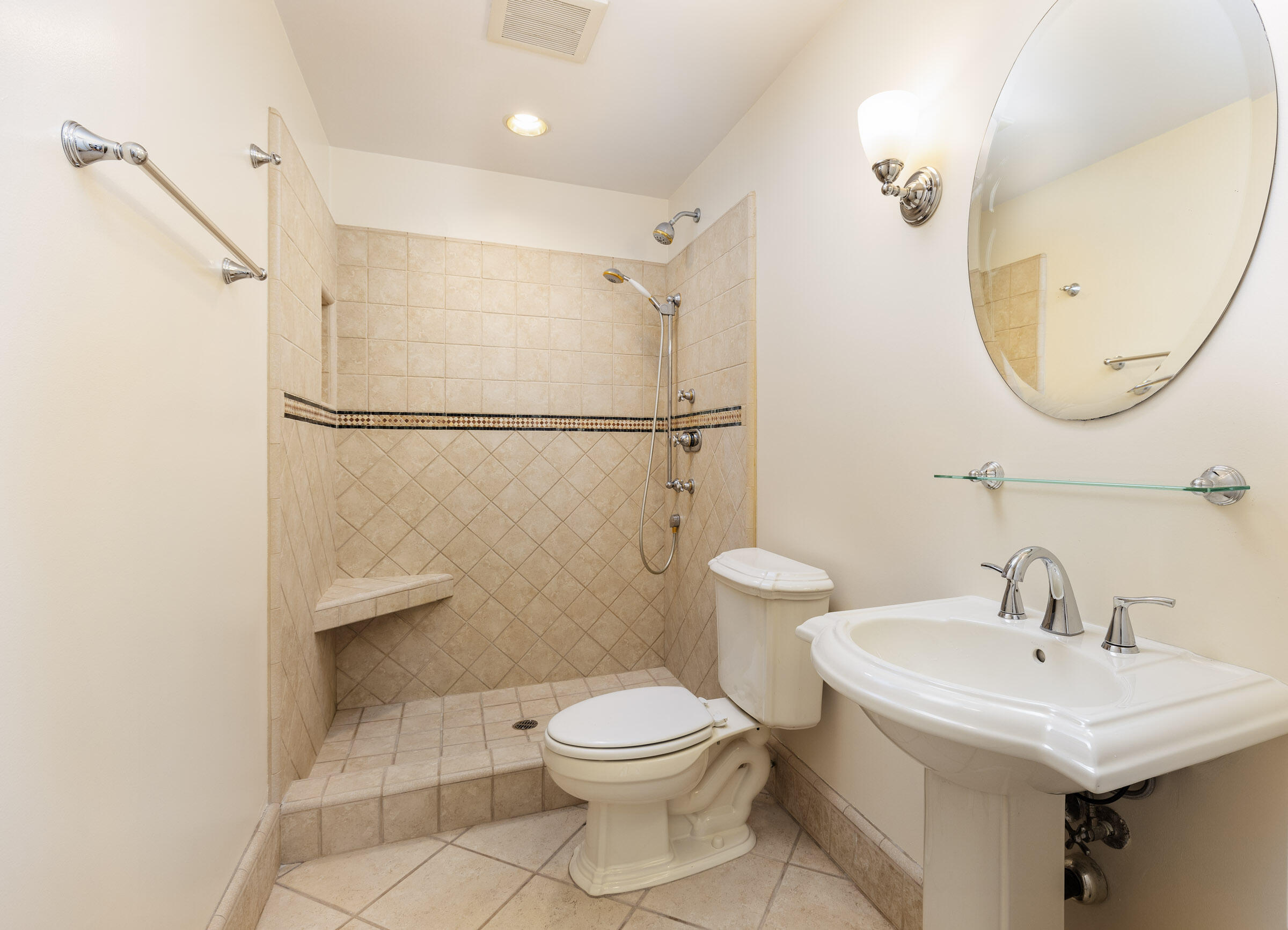 3375 Foothill Road, Unit 632 Carpinteria, CA 93013 - Photo 10 of 16 a white toilet sitting next to a bathroom sink