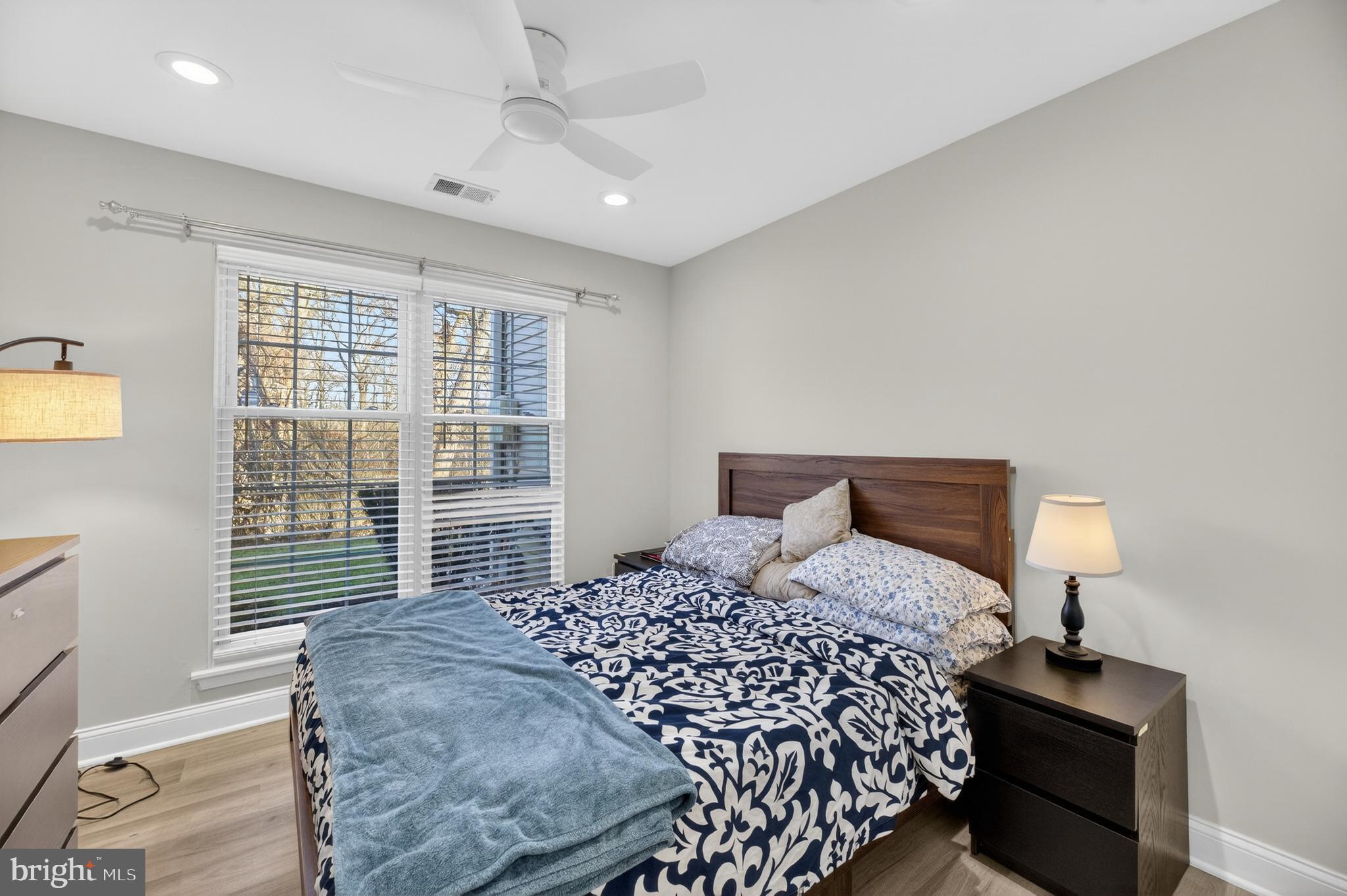 133 Andover Place Robbinsville, NJ 08691 - Photo 13 of 20 a bedroom with a bed and wooden floor