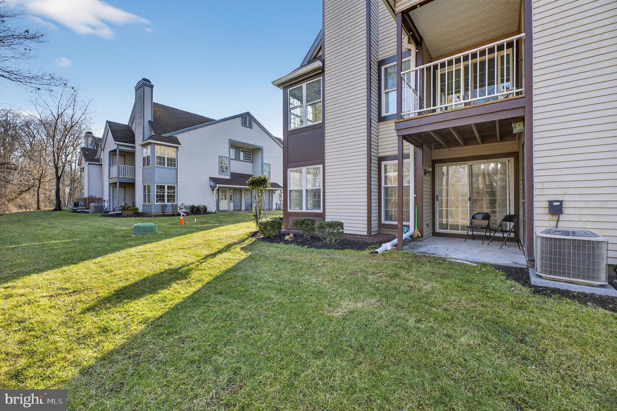 133 Andover Place Robbinsville, NJ 08691 - Photo 16 of 20 a view of a house with a yard and plants