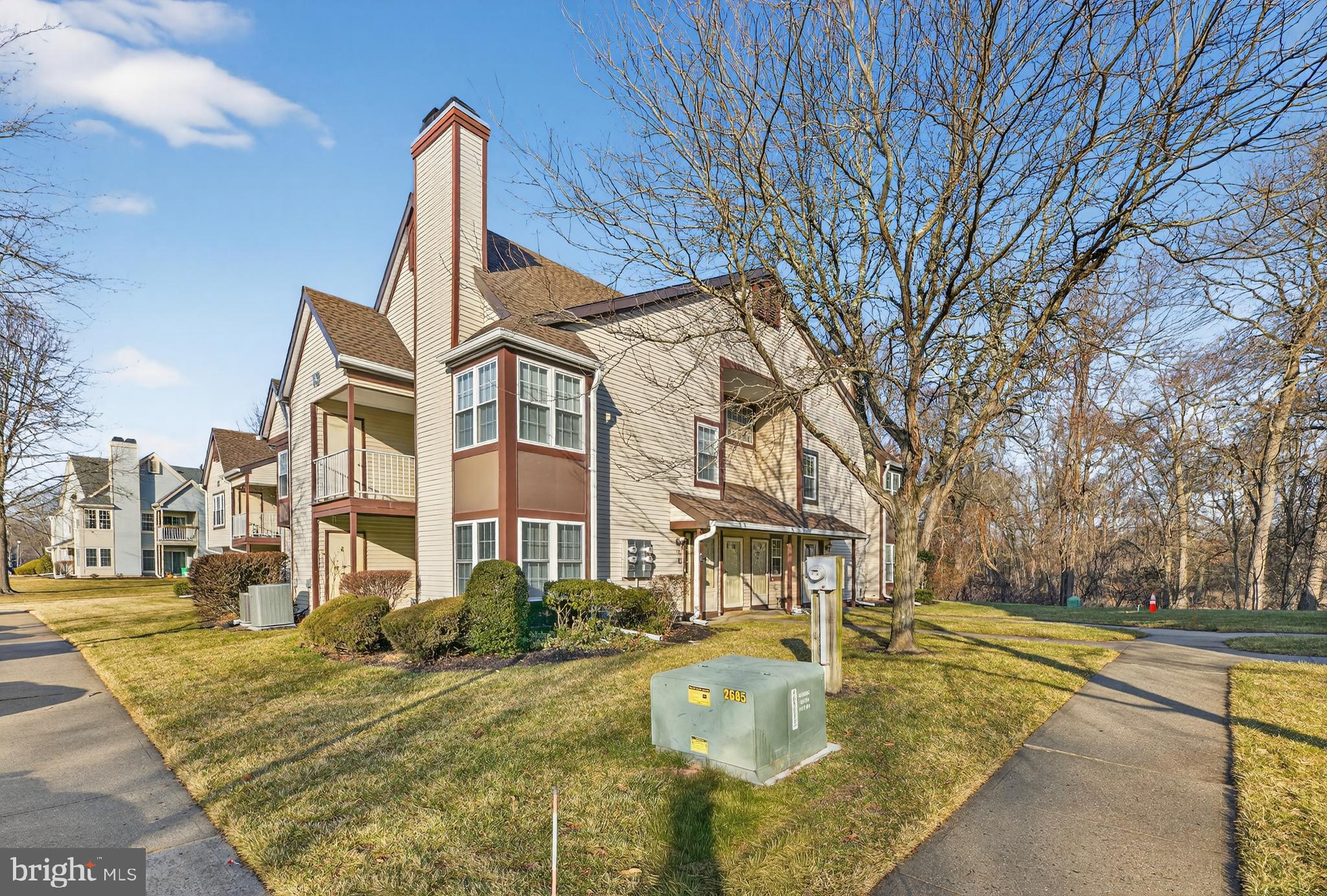 133 Andover Place Robbinsville, NJ 08691 - Photo 17 of 20 a view of a building with a yard