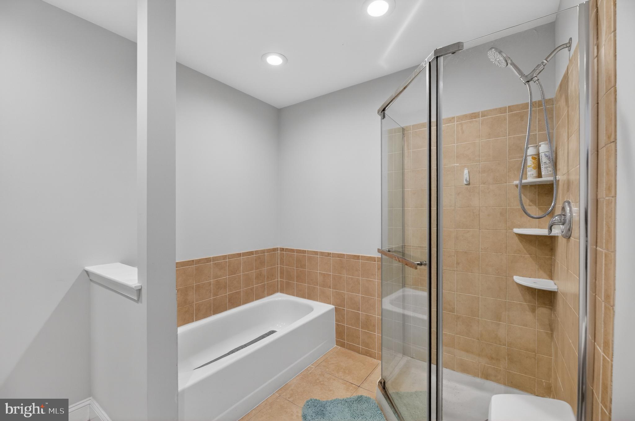 133 Andover Place Robbinsville, NJ 08691 - Photo 19 of 20 a bathroom with a shower and a bath tub