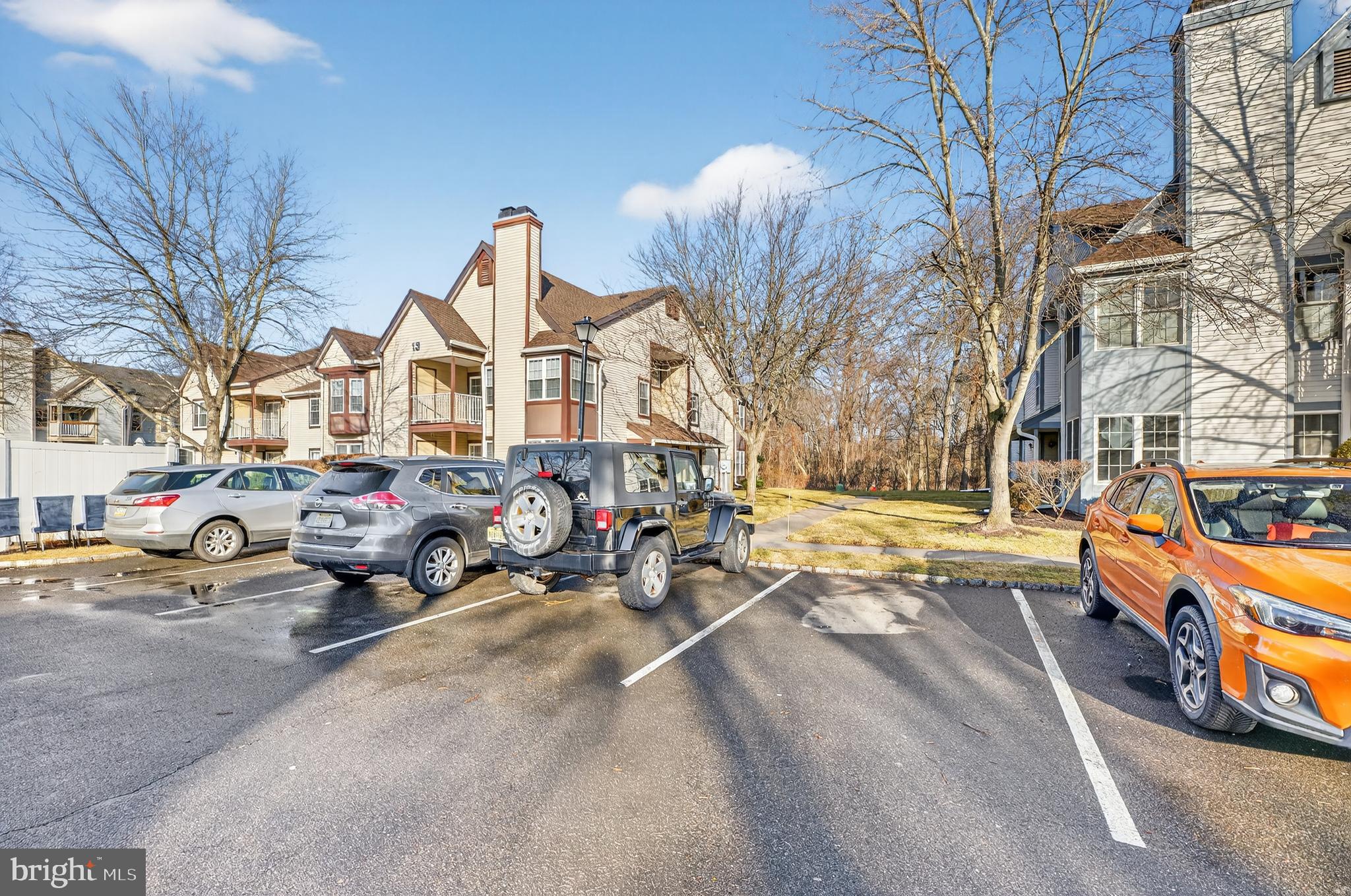 133 Andover Place Robbinsville, NJ 08691 - Photo 4 of 20 a group of cars parked in front of a building