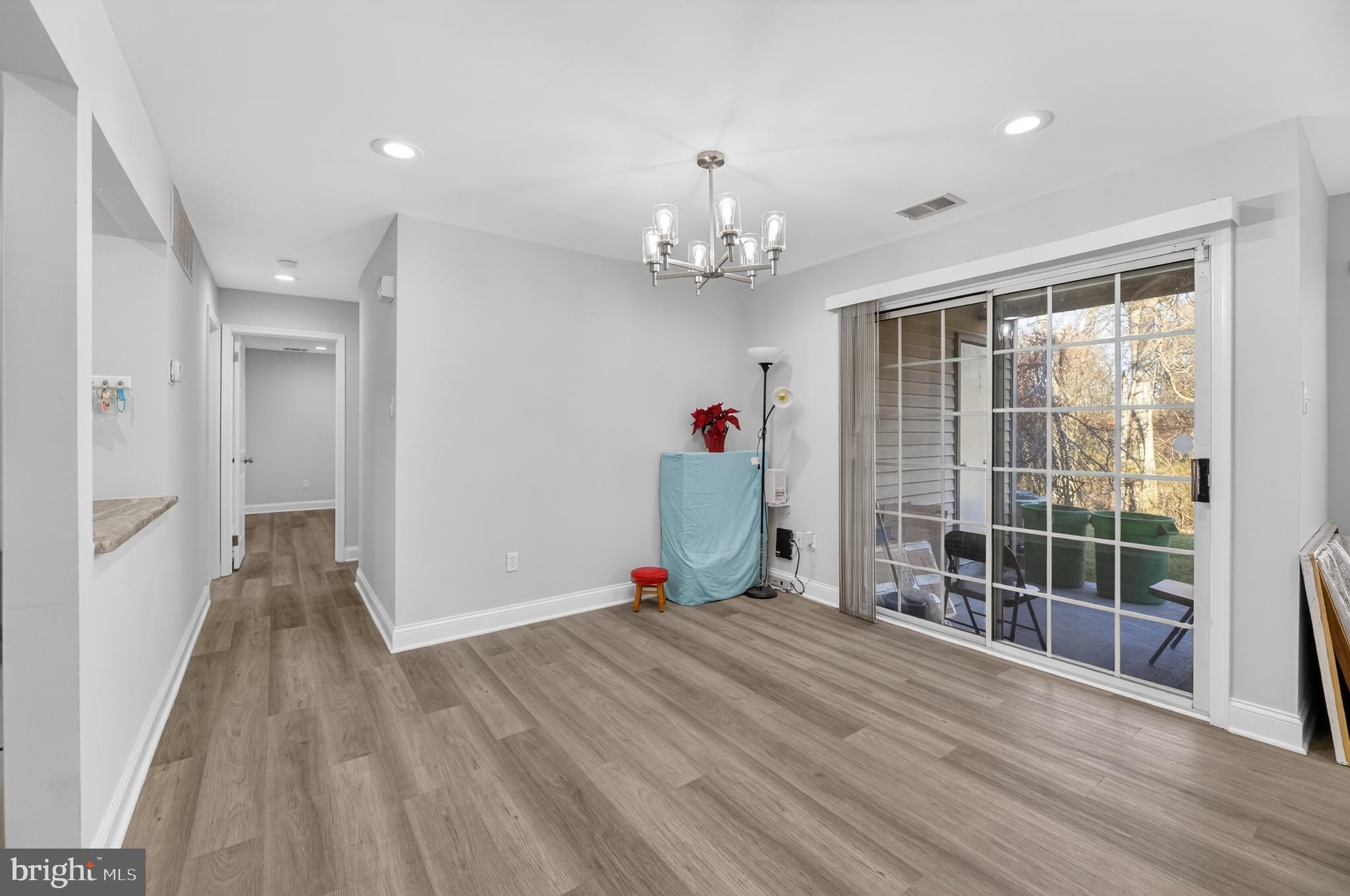 133 Andover Place Robbinsville, NJ 08691 - Photo 8 of 20 a view of a livingroom with wooden floor and entryway