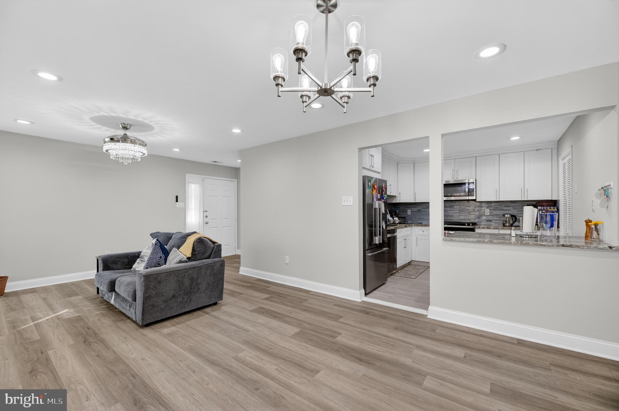 133 Andover Place Robbinsville, NJ 08691 - Photo 9 of 20 a living room with furniture and kitchen view