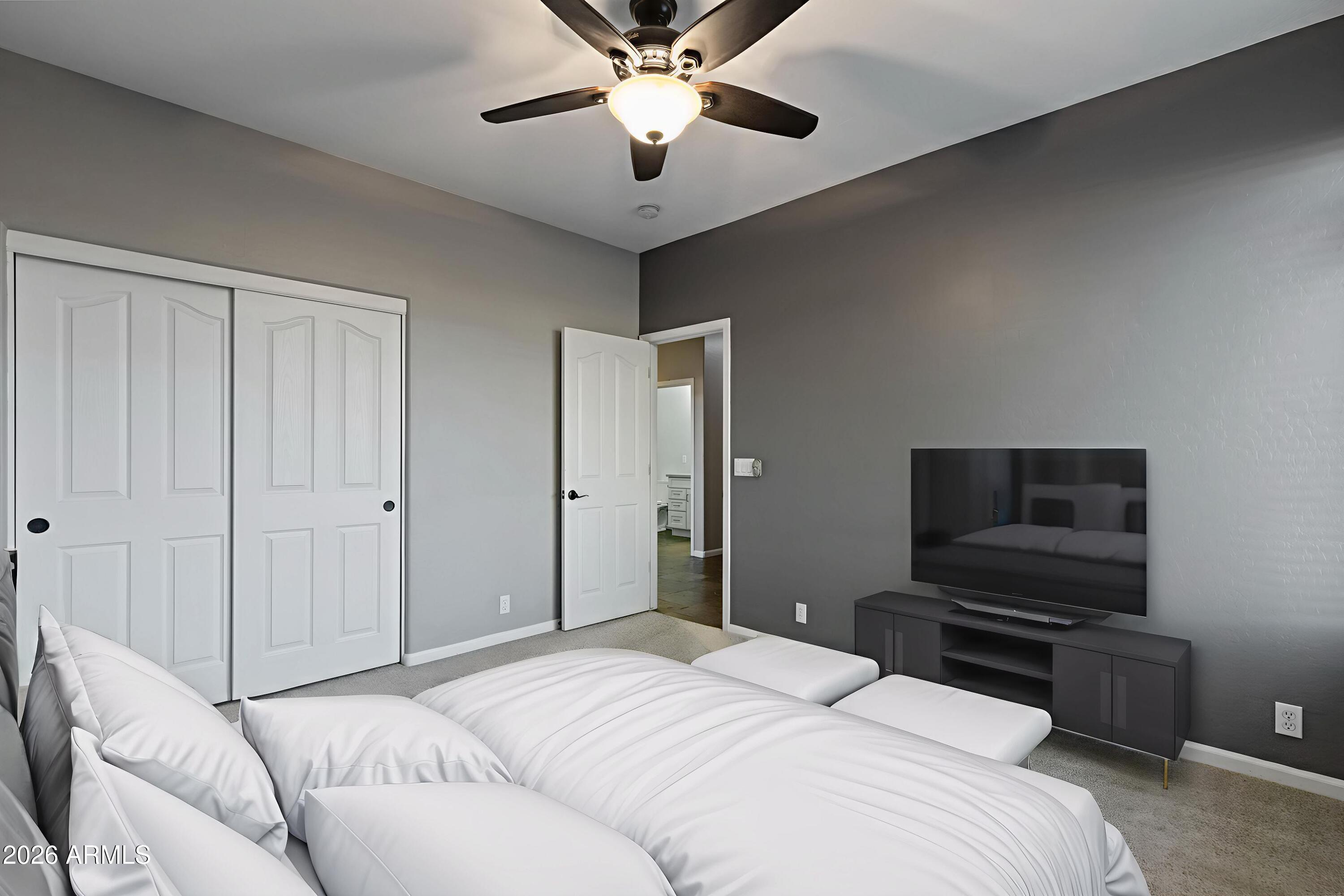 2519 East Rawhide Street Gilbert, AZ 85296 - Photo 11 of 35 a bedroom with a bed and a television