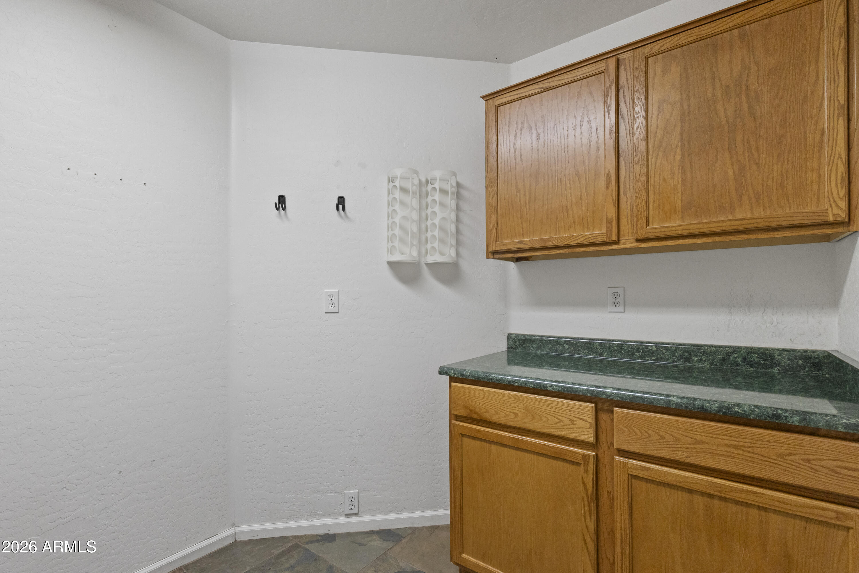 2519 East Rawhide Street Gilbert, AZ 85296 - Photo 16 of 35 a view of a storage and utility room with granite countertop cabinets