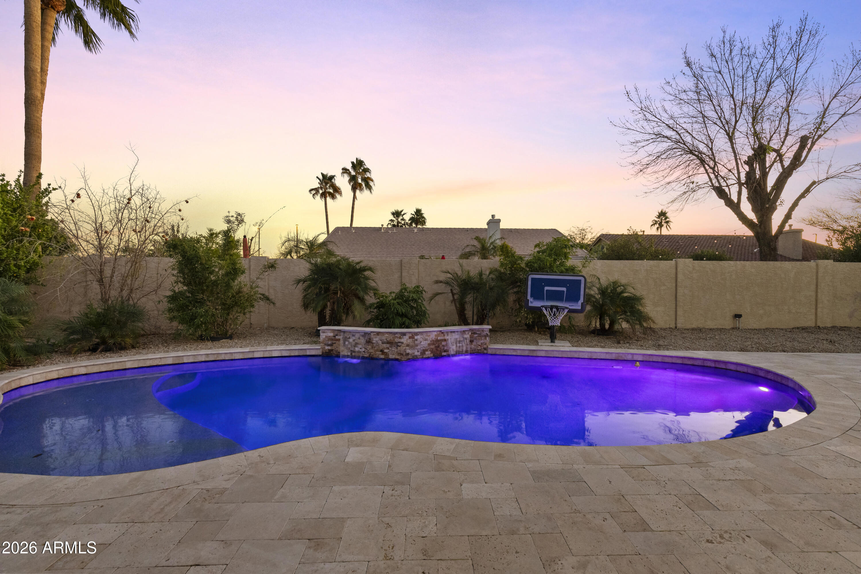 2519 East Rawhide Street Gilbert, AZ 85296 - Photo 21 of 35 a view of a swimming pool with red chairs