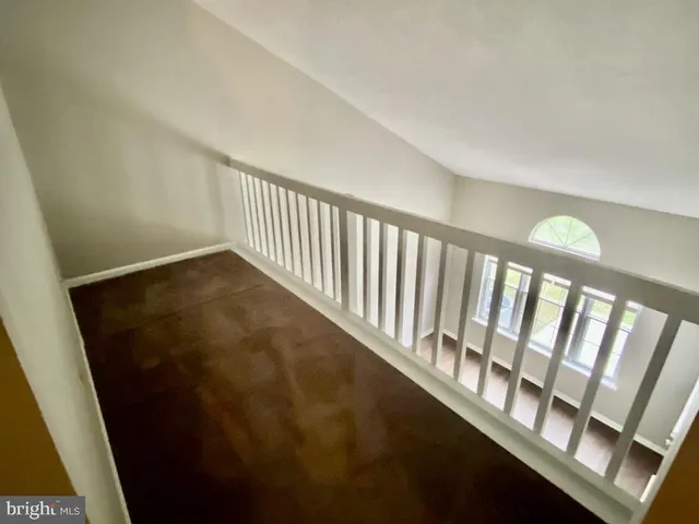 a view of staircase with rug floor