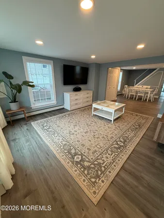a living room with a couch and a flat screen tv