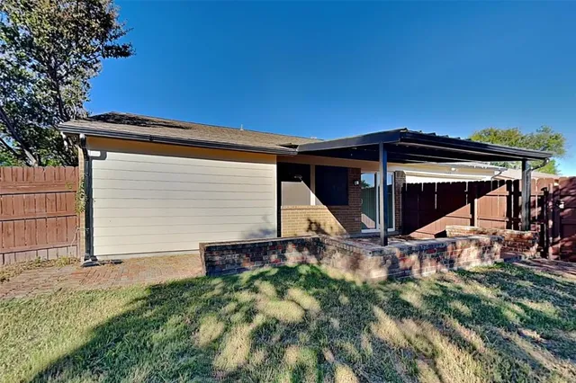 a bathroom with a granite countertop sink a toilet and bathtub