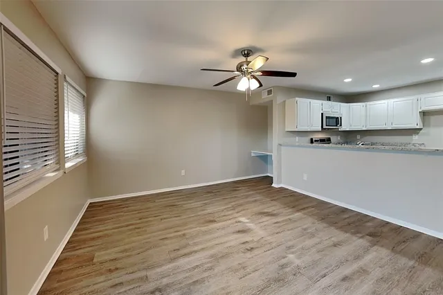 a view of a kitchen with electric appliances