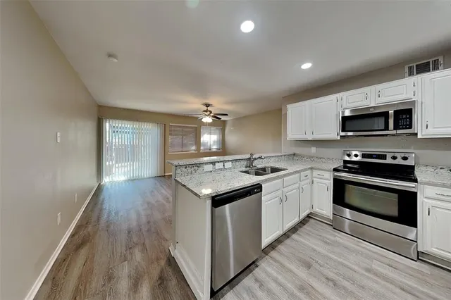 a view of backyard with small cabin and wooden fencing