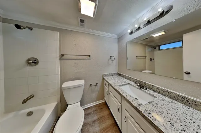 a view of a livingroom with a ceiling fan and window