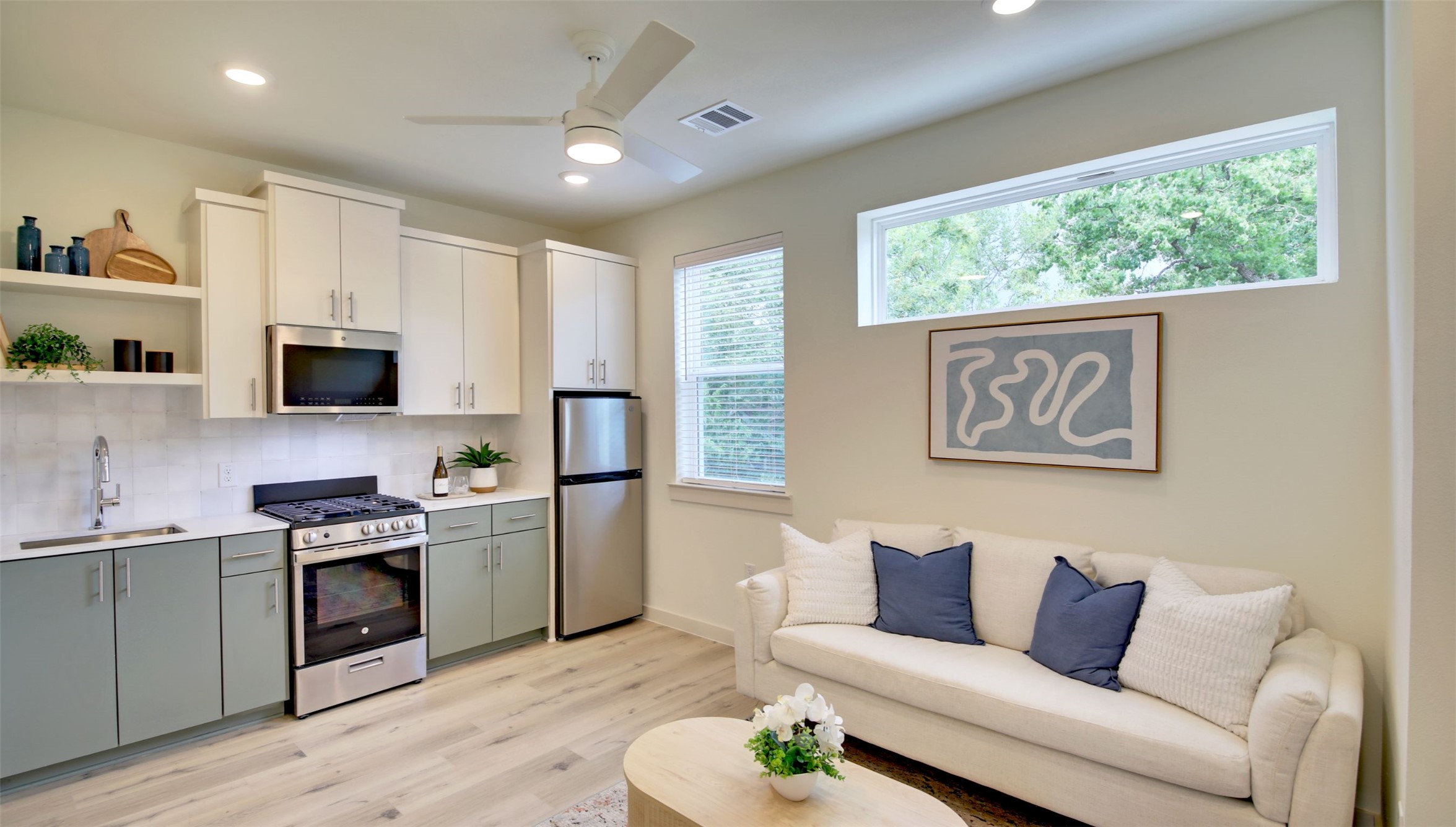 6802 Montana Street, Unit 2 Austin, TX 78741 - Photo 4 of 13 Bright and open-concept living area with a well-appointed kitchen and comfortable seating.