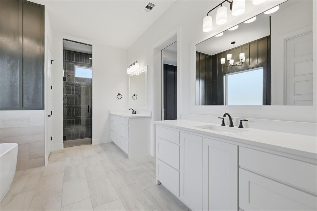 6412 Rigel Road Godley, TX 76044 - Photo 24 of 38 a bathroom with a sink a toilet and mirror