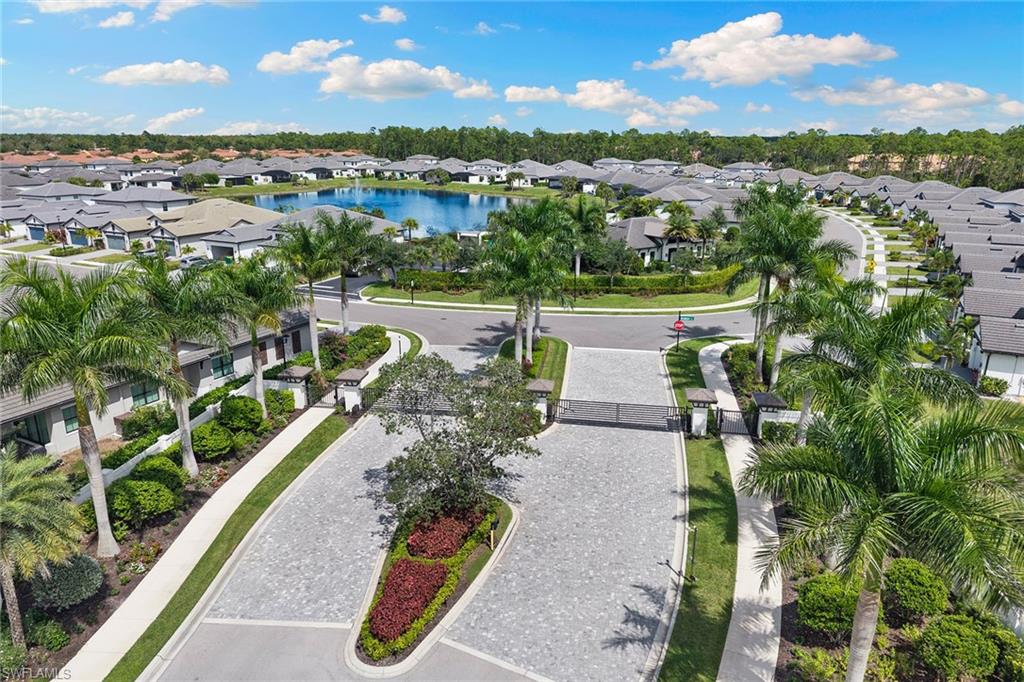 14875 Loggerhead Drive Naples, FL 34120 - Photo 22 of 28 a view of a lake with a city