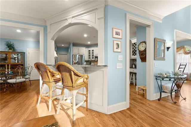 a view of a dining room with furniture and wooden floor
