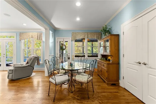 a view of a livingroom with furniture window and wooden floor