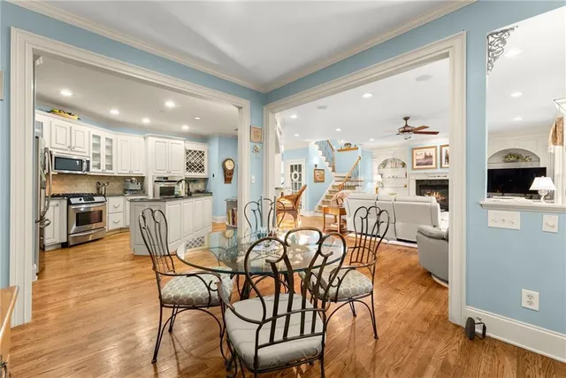 a view of a dining room kitchen with furniture and wooden floor
