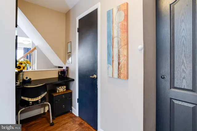 a view of an entryway with wooden floor