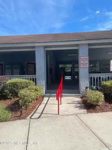 a living room with lots of furniture and a chandelier