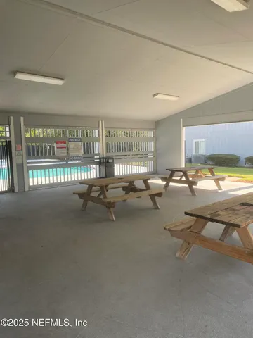 a view of a house with a yard and lake view