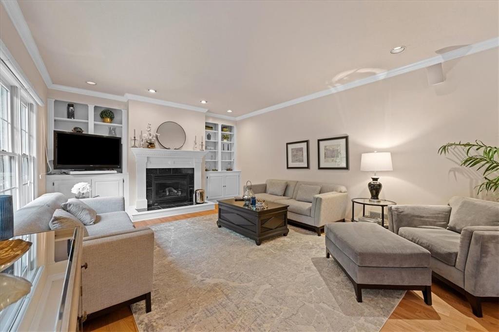 507 Sandra Lane Cheswick, PA 15024 - Photo 13 of 24 a living room with furniture a flat screen tv and a fireplace
