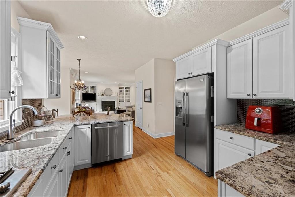 507 Sandra Lane Cheswick, PA 15024 - Photo 9 of 24 a kitchen with stainless steel appliances granite countertop a sink stove and refrigerator